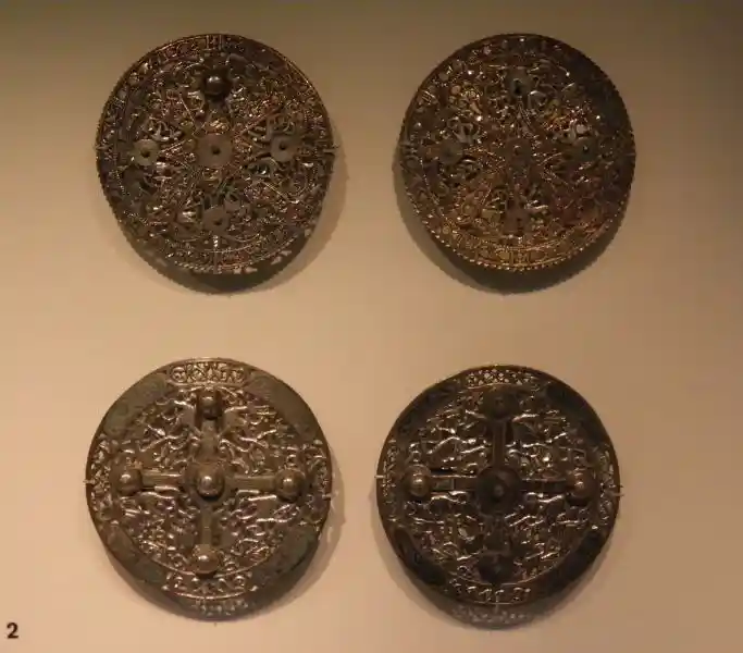 Cross and solar disc silver brooches